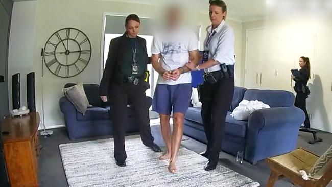 QLD Police vision of Robert Crawford arrested at his home.