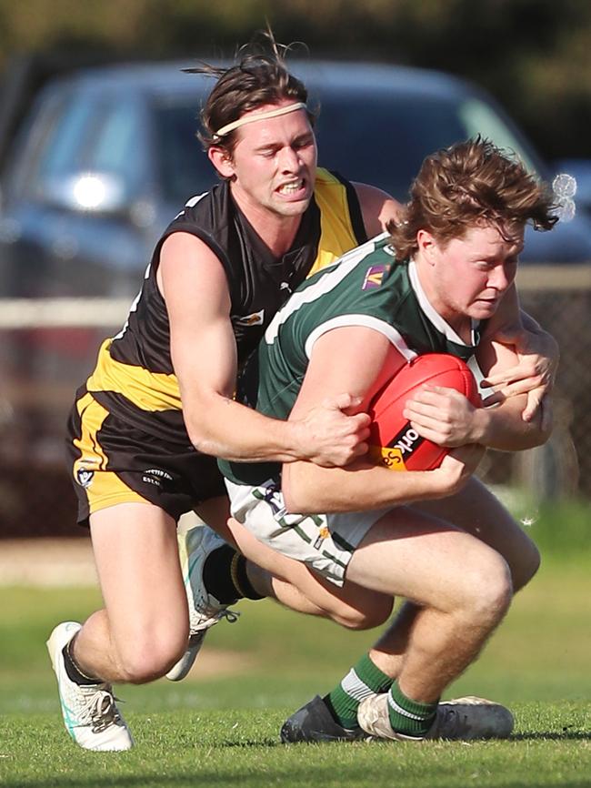 Rochester’s Bailey Wileman lays a strong tackle on Echuca’s Jackson Stewart.