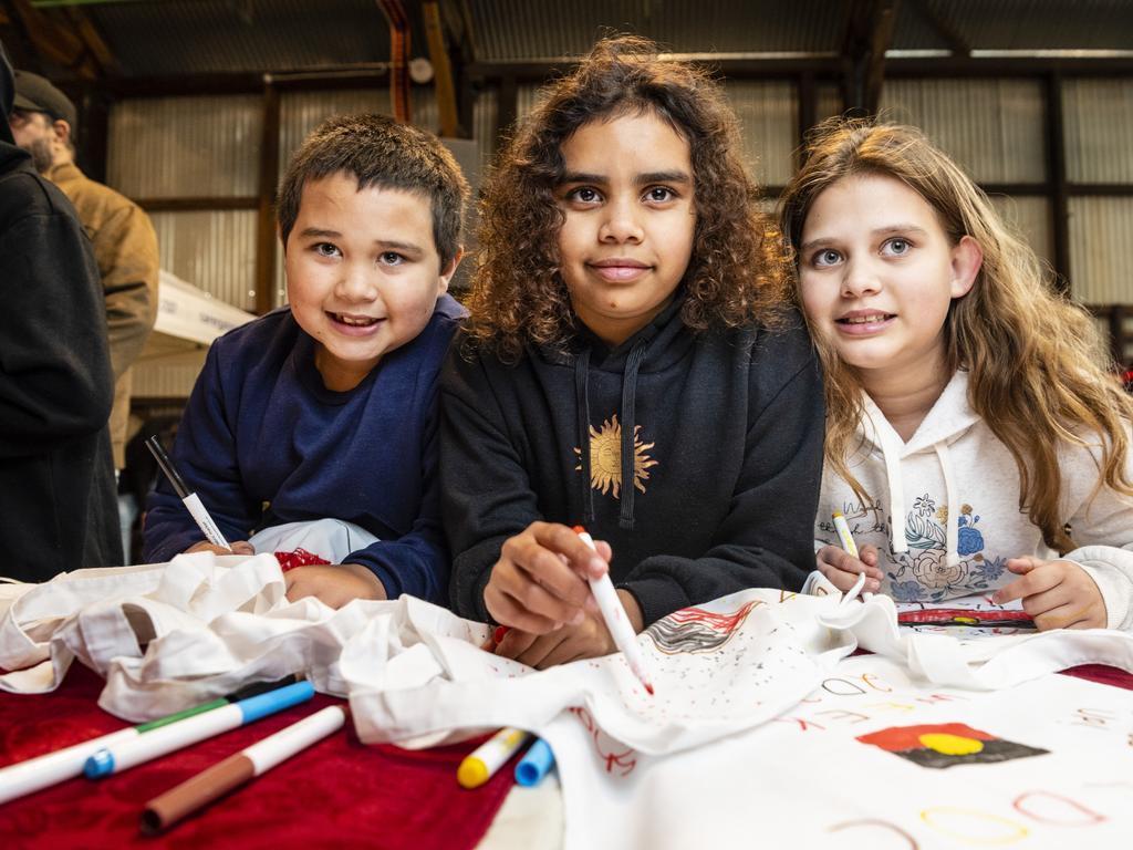 Drawing are (from left) Tysean, Jahkota and Azariah Landsborough at the Toowoomba NAIDOC Week celebrations at The Goods Shed, Monday, July 4, 2022. Picture: Kevin Farmer