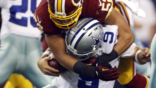 Dallas Cowboys quarterback Tony Romo is sacked by Washington.