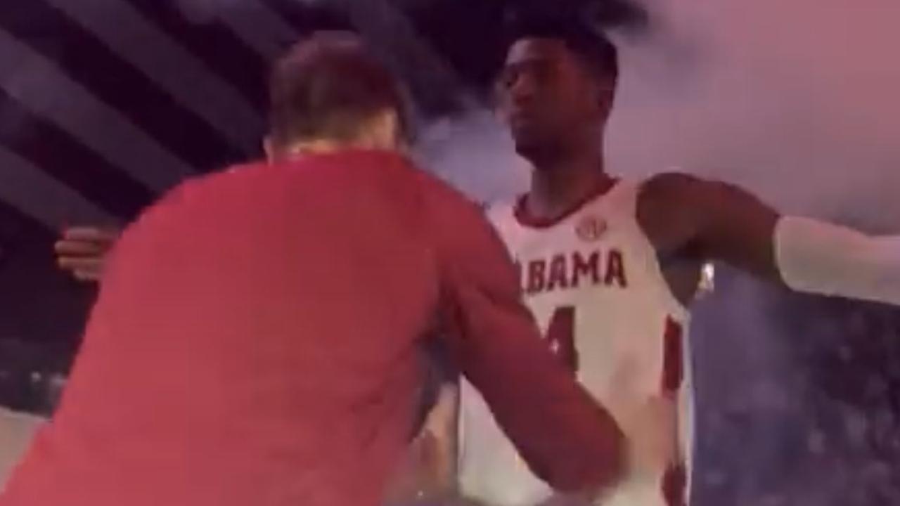 Alabama's Brandon Miller pretends to be frisked.