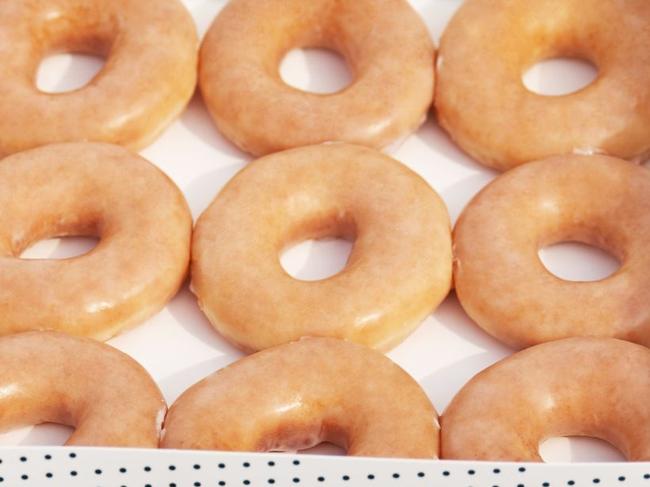 Krispy Kreme stores across Queensland are giving away 100,000 free original glazed doughnuts for this year's Doughnut Day.