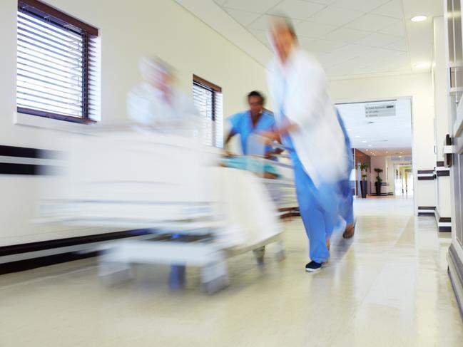 Hospital staff rushing a patient off to theatre in urgency Emergency ward. Picture: istock