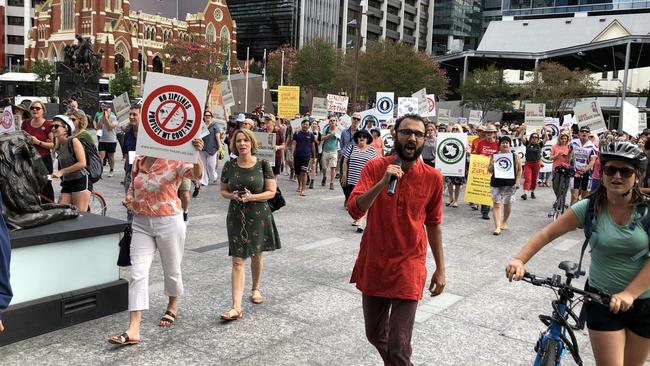 Protesters walk through King George Square. Picture: Mark Cranitch