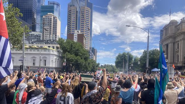 Some of the hundreds of Invasion Day protesters marching in Melbourne. Picture: Angus McIntyre