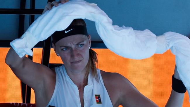 Petra Kvitova uses an ice towel during a break in play ahead of the Rod Laver Arena roof being closed because of the heat. Picture: David Gray/AFP