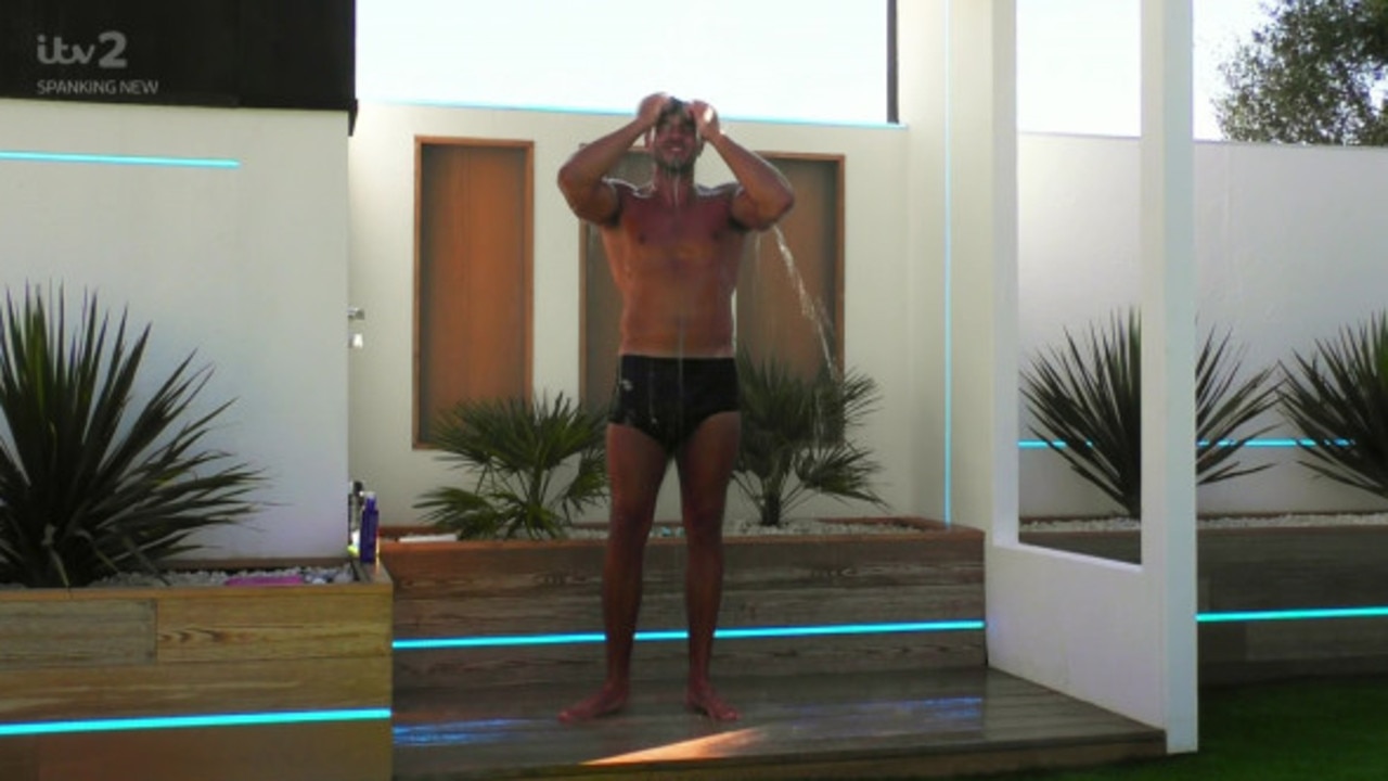 Contestant Tommy in the villa's outdoor showers.