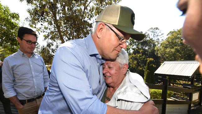 Then-Prime Minister Scott Morrison consoling Pamela Skeen after the fire. (AAP Image/Dave Hunt)