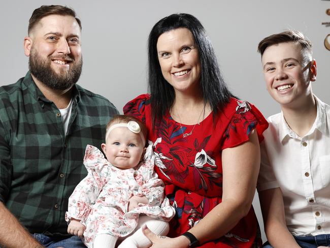 NSW NETWORK JUNE 1, 2022. Deborah Hughes with her 6-month-old daughter Ruby, husband Brendan and son Marcus,13, at home in Spring Farm. The couple had five failed IVF attempts before switching to Genea and having baby Ruby after just one cycle. Picture: Jonathan Ng