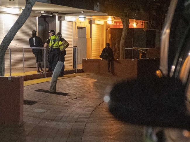 Police officers chat to a young man on the streets of Alice Springs at night .Thursday January 26,2023.Picture Mark Brake