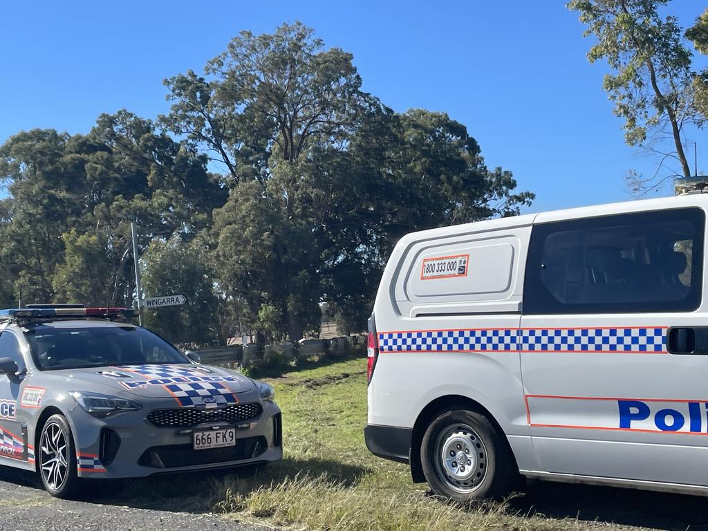 A truck carrying a dog trailer has crashed through a guard rail and rolled on its side on the Cunningham Highway, 20kms west of Warwick. Photo: Warwick Daily News