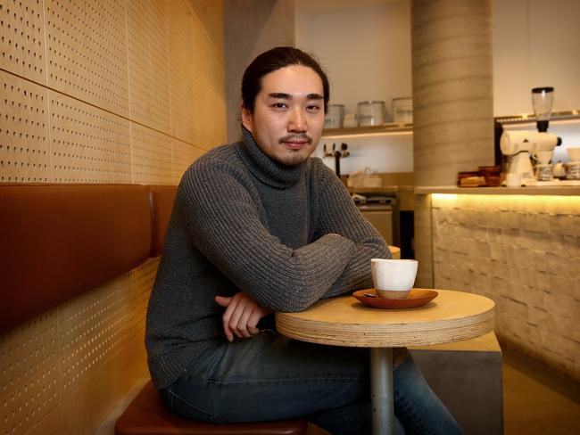 Kit Tran pictured in his Haymarket coffee shop. Picture: Toby Zerna