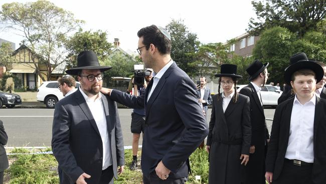 Federal MP Josh Burns meets people gathered outside the Adass Israel synagogue as shock sets in over the fire-bombing of this place of worship. Picture: NewsWire/ Andrew Henshaw