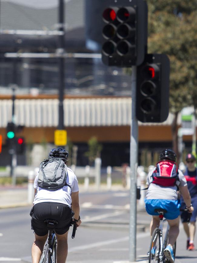 Cyclists running red lights at Docklands.