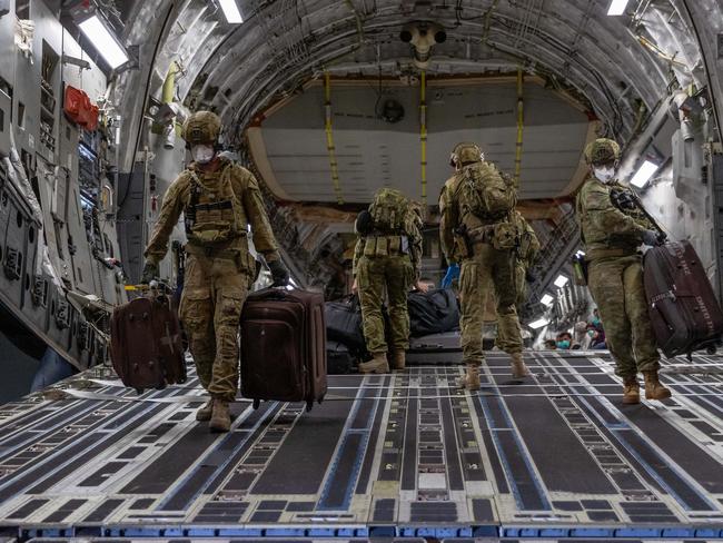Australian Defence Force personnel unload luggage from a Royal Australian Air Force C-17A Globemaster at Australiaâs main operating base in the Middle East, following an evacuation operation from Kabul, Afghanistan. *** Local Caption *** A Royal Australian Air Force C-17A Globemaster III aircraft has joined evacuation operations conducting the second Australian Defence Force flight evacuating Australian nationals and approved foreign nationals from Hamid Karzai International Airport in Kabul, Afghanistan.  The aircraft is now part of a fleet of two C-17A Globemaster III aircraft, two C-130J Hercules aircraft and a KC-30 Multirole Tanker Transport aircraft deployed in support to Australian and coalition evacuation operations.