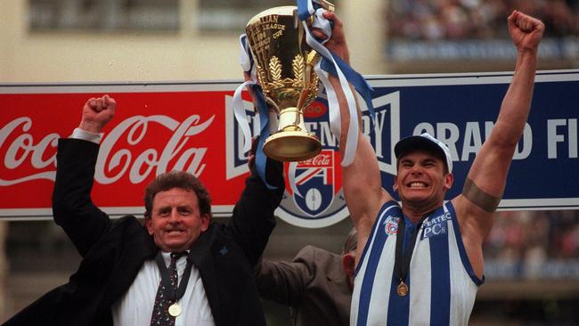 Pagan and Wayne Carey hold the 1996 premiership cup.