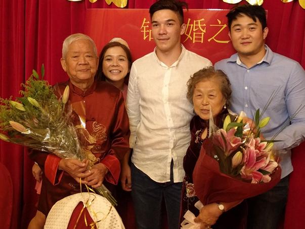 Mr Shi celebrating his 60th wedding anniversary (far left) with his wife and three of his seven grandchildren.