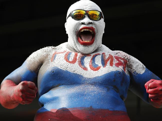 Robert Youmbi, from Cameroon, who poses in body paint of the Russian side. AP Photo/Rebecca Blackwell