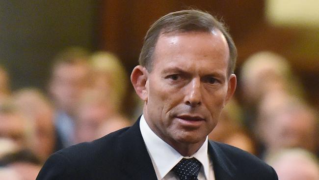 MELBOURNE, AUSTRALIA - MARCH 27: Prime Minister Tony Abbott is escorted to his seat whilst attending the funeral of former Australian Prime Minister Malcolm Fraser on March 27, 2015 in Melbourne, Australia. Australia's three term prime minister Fraser died at the age of 84 after a brief illness on March 20, 2015. (Theo Karanikos-Pool/Getty Images)