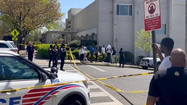 Police urged people in the area to look out for a green vehicle fleeing the scene after a gunman opened fire on mourners outside a funeral home. Picture: John Henry/WUSA9