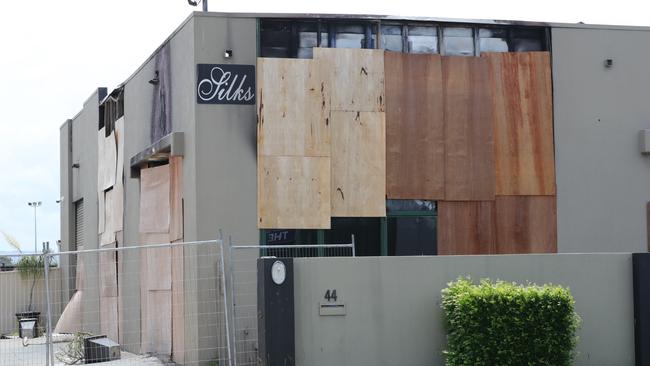 The boarded-up shell of Silks brothel at Bundall after fire destroyed the premises. Picture Glenn Hampson