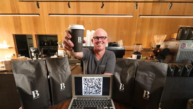 Blackboard Varsity general manager Wayne Keating displays a QR code system at his shop. Picture Glenn Hampson