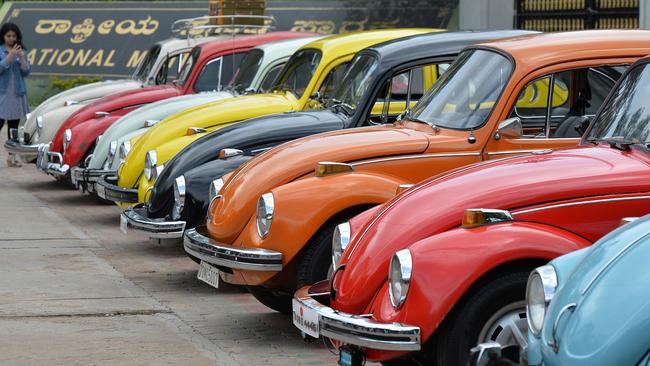 (FILES) In this file photo taken on June 24, 2018 vintage Volkswagen Beetle cars are parked in a row during a rally held as part of the 23rd anniversary of "World Wide VW Beetle Day", in Bangalore. - Volkswagen announced on September 13, 2018 that it would end production of its iconic "Beetle" cars in 2019 following a pair of final editions of the insect-inspired vehicles.The move comes as Volkswagen emphasizes electric autos and larger family-oriented vehicles, said Hinrich Woebcken, chief executive of Volkswagen Group of America. But Woebcken opened the door to reviving the model at some point, saying "never say never." (Photo by MANJUNATH KIRAN / AFP)