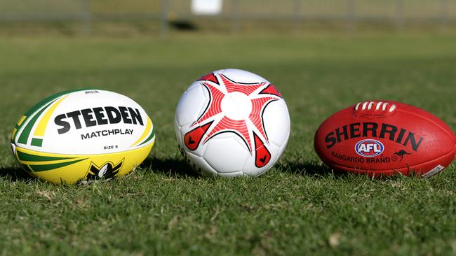 Generic football shots. Steeden Rugby League NRL football, soccer ball and Sherrin AFL football. sport / balls