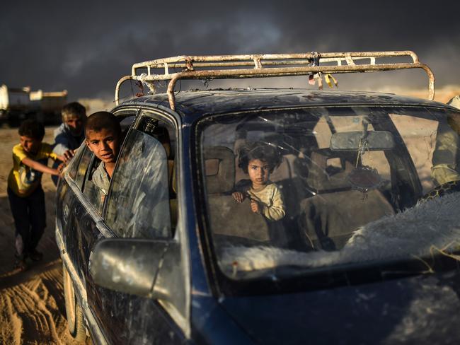Displaced Iraqis arrive at refugee camp on October 22, 2016 in the town of Qayyarah, south of Mosul, as an operation to recapture the city of Mosul from the Islamic State group takes place. Picture: AFP PHOTO / BULENT KILIC