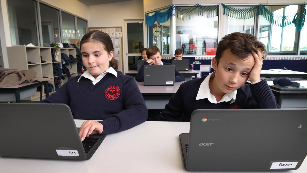 Thousands of students will complete NAPLAN testing online for the first time this week. Victoria’s St John Vianney’s Primary School has been preparing for the national online assessment to make sure it goes ahead without any tech troubles. Ivy, 11, and Leroy, 11, sit a trial NAPLAN test on laptops with fellow year 5 students. Picture: David Caird