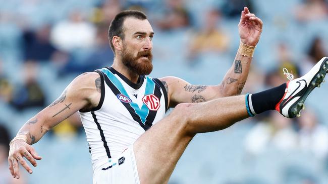 MELBOURNE, AUSTRALIA - MARCH 24: Charlie Dixon of the Power kicks the ball during the 2024 AFL Round 02 match between the Richmond Tigers and the Port Adelaide Power at the Melbourne Cricket Ground on March 24, 2024 in Melbourne, Australia. (Photo by Michael Willson/AFL Photos via Getty Images)