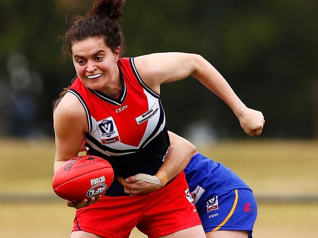 MELBOURNE, AUSTRALIA - JULY 08:  Meghan McDonald of the Falcons is tackled by Amanda McDonough of the Eagles during the VFL Women's match between Cranbourne and Darebin at Casey Fields on July 8, 2017 in Melbourne, Australia.  (Photo by Daniel Pockett/AFL Media/Getty Images)