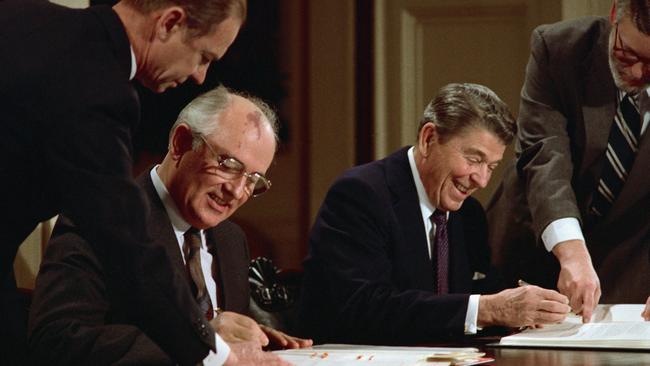 Ronald Reagan and Soviet leader Mikhail Gorbachev sign the arms control agreement banning the use of intermediate-range nuclear missiles in 1987.