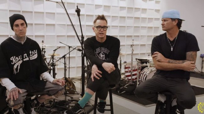 L-R: Travis Barker, Mark Hoppus and Tom DeLonge announce their new album.