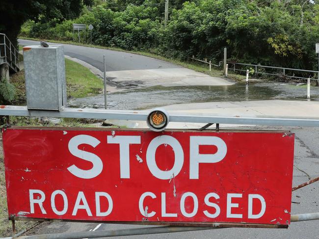 SUNDAY TELEGRAPH - Pictured is Oxford Falls Road closed due to flooding. Picture: Tim Hunter.