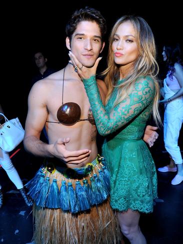 Host Tyler Posey (L) and actress-singer Jennifer Lopez attend FOX’s 2014 Teen Choice Awards. Picture: WireImage