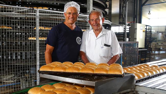 Warren Marrable and his father Harvey Marrable at Gold Coast Bakeries. The company is marking its 60th anniversary this weekend. Photo: David Clark