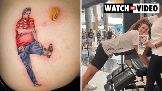 Ex-AFL player Daniel Gorringe gets tattoo of Gold Coast coach on his backside