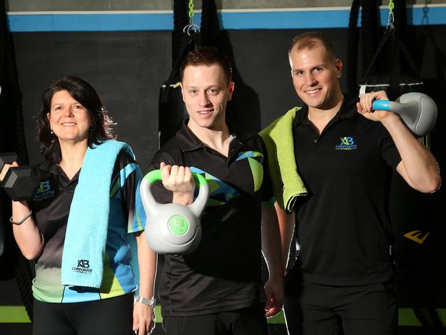 Aaron Nauta (right) with Connie Raso and Brendan Daynes at AB Corporate Fitness. Picture: Hamish Blair