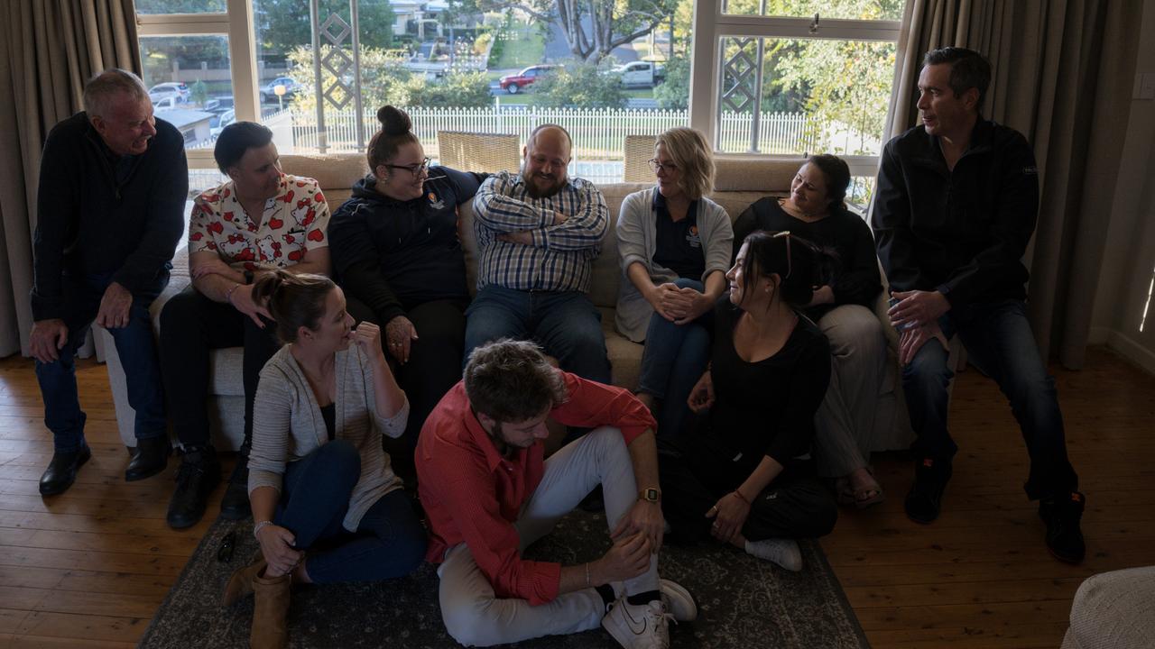 Joel Toombs (centre) sits with a number of other Sunrise Way graduates and students who have been part of the program. Many are at different journeys, some volunteering at the centre, working full-time or coming towards graduation. Picture: Christine Schindler