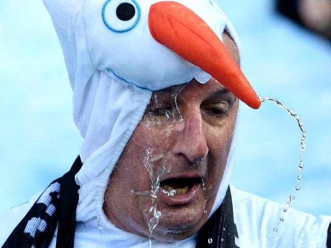 David Koch takes part in the Big Freeze Ice Slide challenge fundraising event for Motor Neurone Disease before the Melbourne Demons and Collingwood Magpies round 12 match at the MCG in Melbourne, Sunday, June 13, 2016. (AAP Image/Tracey Nearmy) NO ARCHIVING