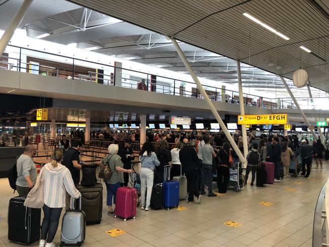 People stand in queue at Amsterdam Schiphol Airport. Picture: Selman Aksunger/Anadolu Agency via Getty Images