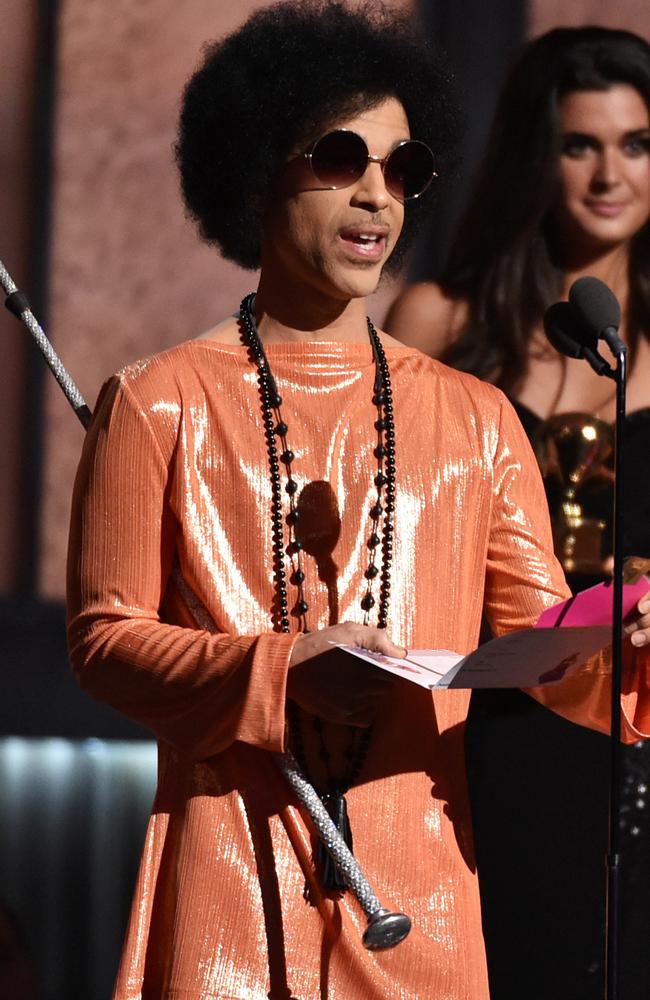 Orange is the new black ... Prince presents the award for album of the year. Picture: John Shearer/Invision/AP