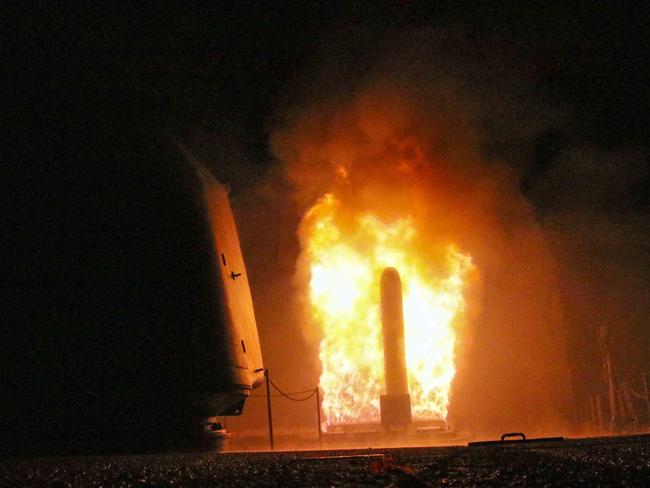 The guided-missile cruiser USS Monterey (CG 61) fires a Tomahawk land attack missile  as part of the military response to Syria's use of chemical weapons.