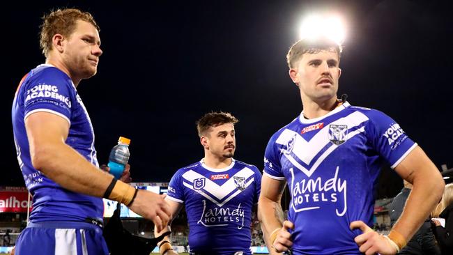 CANBERRA, AUSTRALIA - AUGUST 20: Matt Burton, Reed Mahoney  and Toby Sexton of the Bulldogs react at full timeduring the round 25 NRL match between Canberra Raiders and Canterbury Bulldogs at GIO Stadium on August 20, 2023 in Canberra, Australia. (Photo by Jeremy Ng/Getty Images)