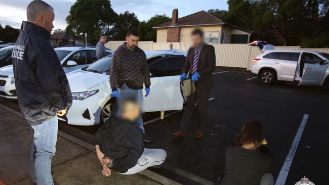 A dozen people were arrested across the dawn raids. Picture: NSW Police