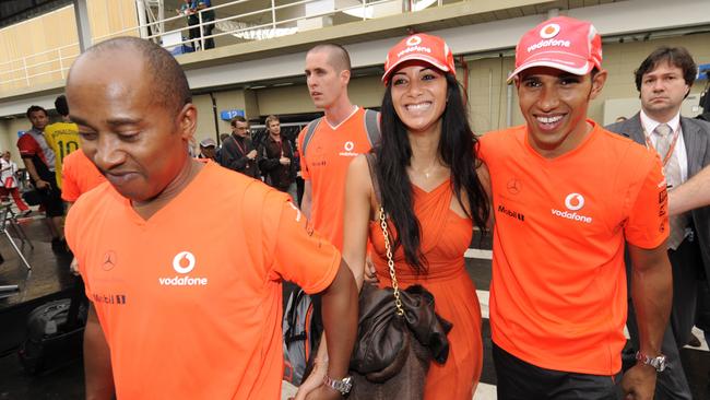 By his side through most of the early years was his father Anthony, left, and his girlfriend, Pussycat Doll singer Nicole Scherzinger. Here they’re all smiles after he secured the 2008 Formula One world drivers' championship by finishing fifth in the Brazilian Grand Prix. Photo: AP Photo