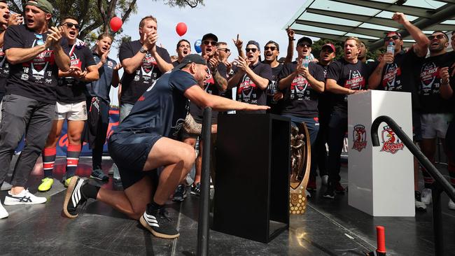 Champions: Roosters players sing the team song. Picture: Brett Costello