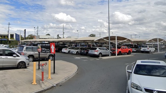 A pair of scammers demanded $100 from a shopper outside an Ipswich shopping centre, accusing the man of damaging their car.