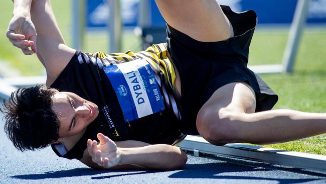 William Dyball from Coffs Harbour falls after dicing for third in the 800m. Picture: Julian Andrews